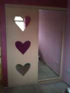 Love heart design with pink glass in the middel door