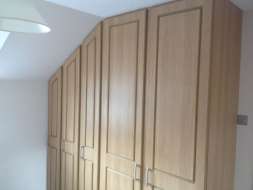 Hinged wardrobes with our oxford design going into the eaves