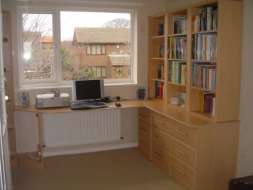 Bookcase fitted ontop of an L shaped desk (full desk)