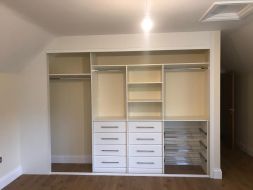 An interior incorporating drawers and wire shoe racks