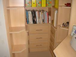 Bookcase fitted into alcove (view of the drawers)