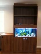 shelving unit built and fitted around a fish tank