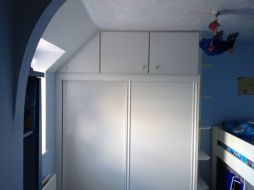 Sliding wardrobe with top box cupboards in woodgrain white