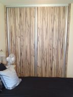 Artwood panel doors with matt silver frames, making a bold impression in the room (straight on view)