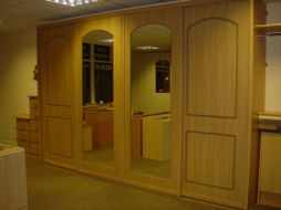 Soft arch design with full mirror inserts in the center doors
